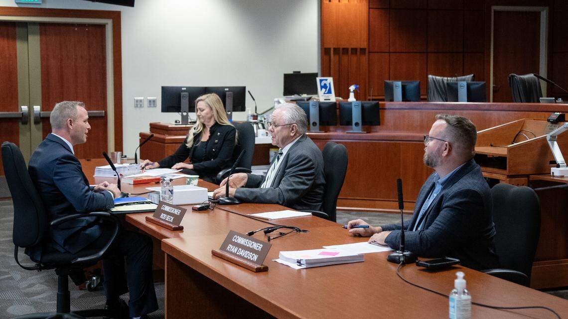 Matt Clifford talks with Ada County commissioners Kendra Kenyon, Rod Beck and Ryan Davidson before his interview for the vacated sheriff’s position at the Ada County Courthouse in Boise in Wednesday, June 30, 2021. The candidates were Doug Traubel, Mike Chilton and Clifford.