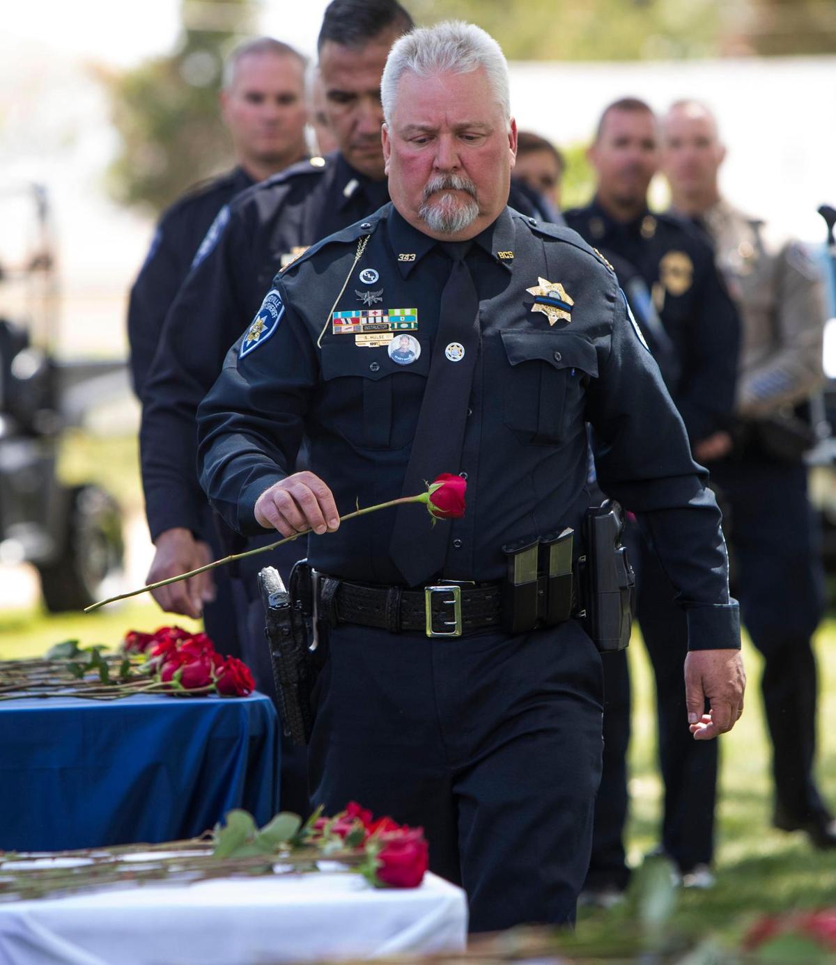 Bonneville County Sheriff Samuel Hulse honors a fallen law-enforcement officer during a memorial ceremony in which he was a guest speaker, Friday, May 20, 2022, at Canyon Hill Church of the Nazarene Community Park in Caldwell.