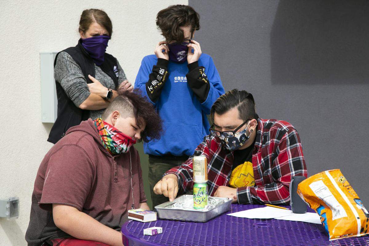 Students work on a science project Tuesday at Caldwell’s Elevate Academy.
