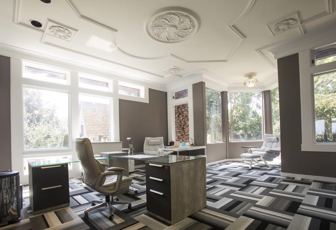 The couple’s home office occupies Morrison’s former library. The space is re-imagined with mix of contemporary colors and designs. They kept Morrison’s French provincial ceiling.