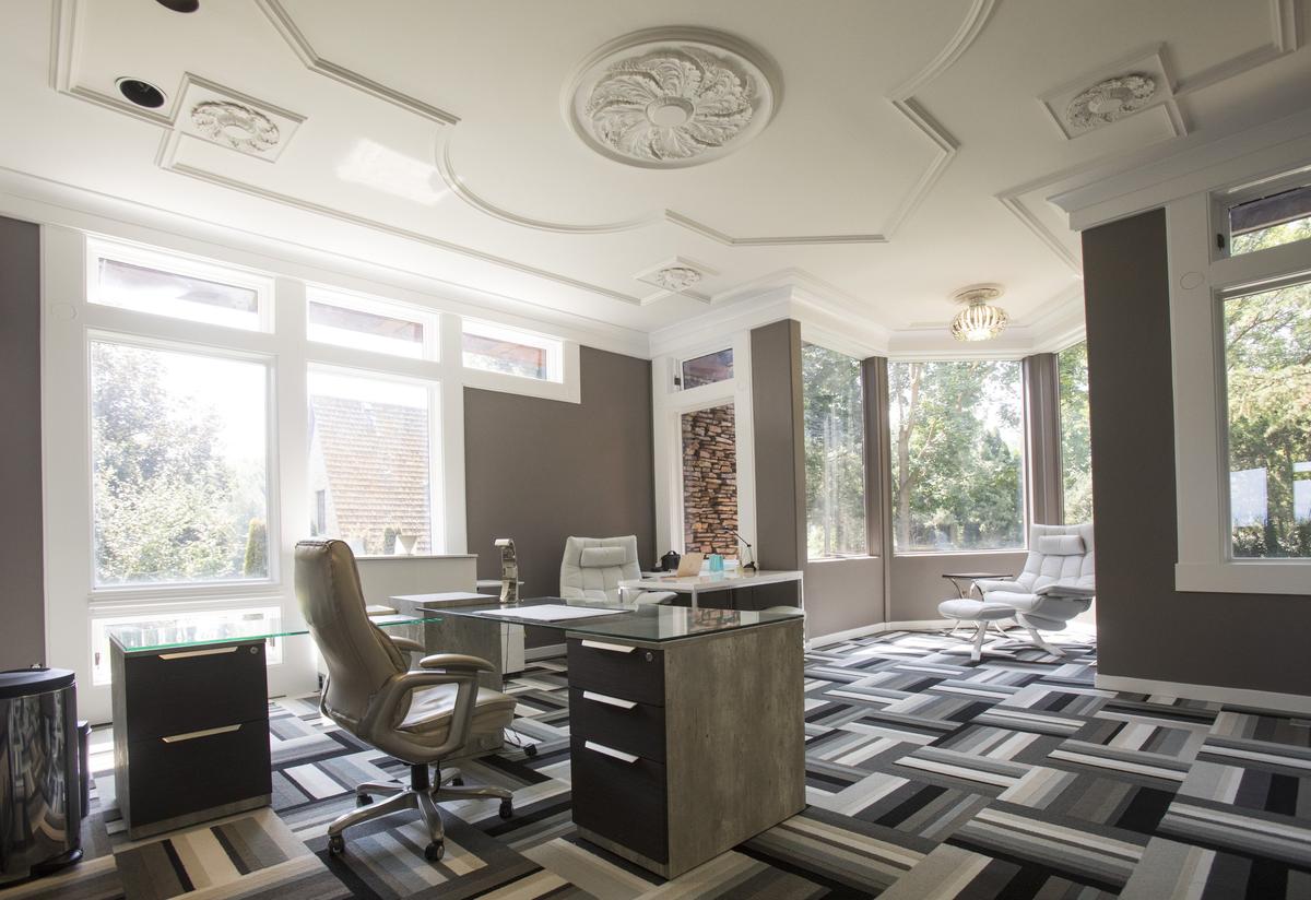 The couple’s home office occupies Morrison’s former library. The space is re-imagined with mix of contemporary colors and designs. They kept Morrison’s French provincial ceiling.