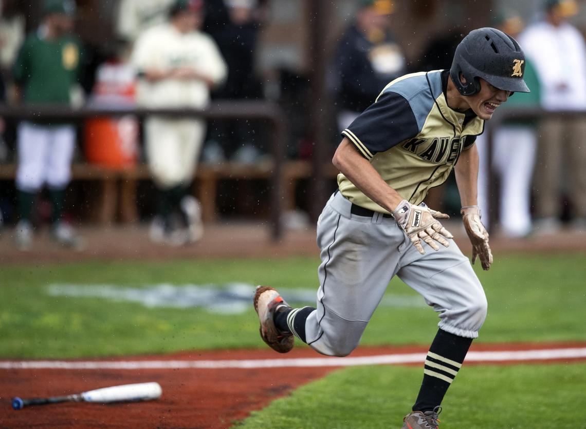 Kuna senior Cole Newman sprints to first after hitting a infield grounder during the first round of the 4A state tournament.