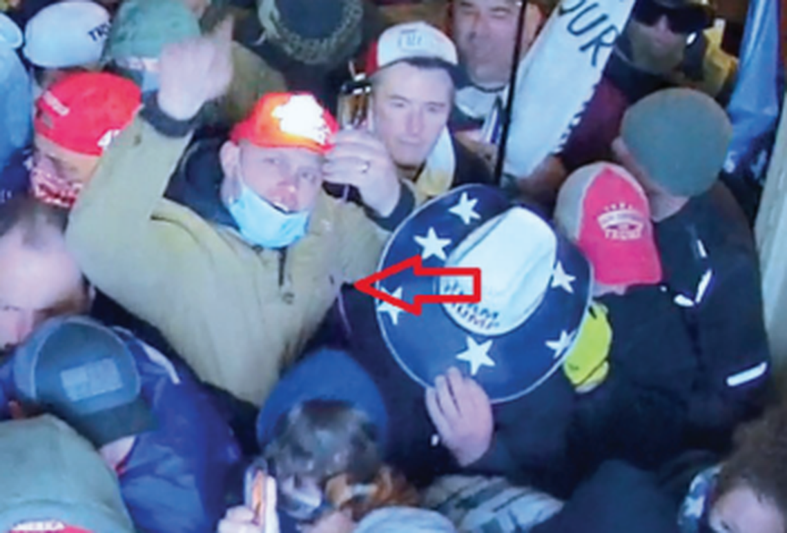 Idaho Falls resident Tyler Tew, center, was arrested on Tuesday, Nov. 30, 2021, for his alleged role in the U.S. Capitol riot on Jan. 6, 2021 in Washington, D.C.