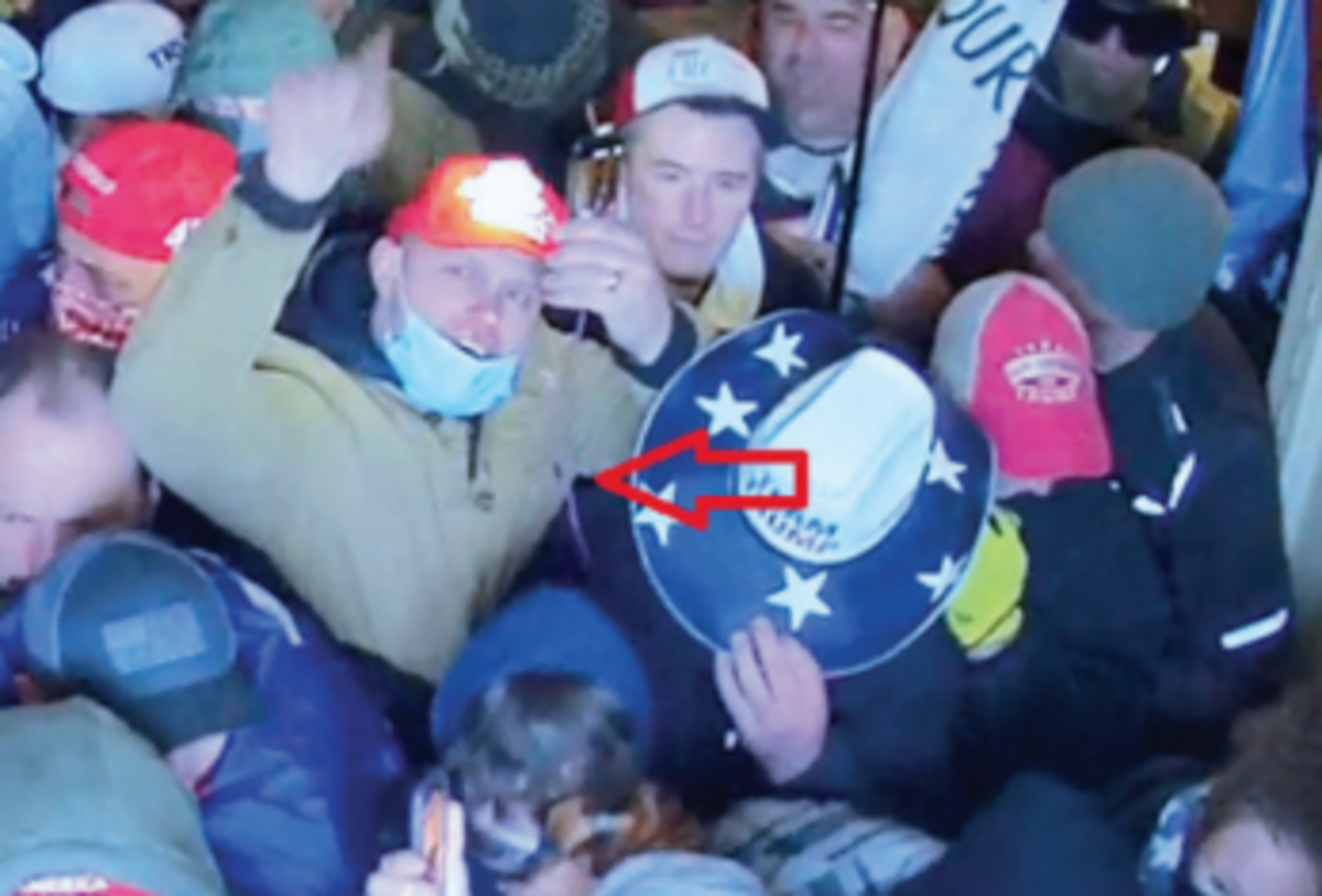 Idaho Falls resident Tyler Tew, center, was arrested on Tuesday, Nov. 30, 2021, for his alleged role in the U.S. Capitol riot on Jan. 6, 2021 in Washington, D.C.