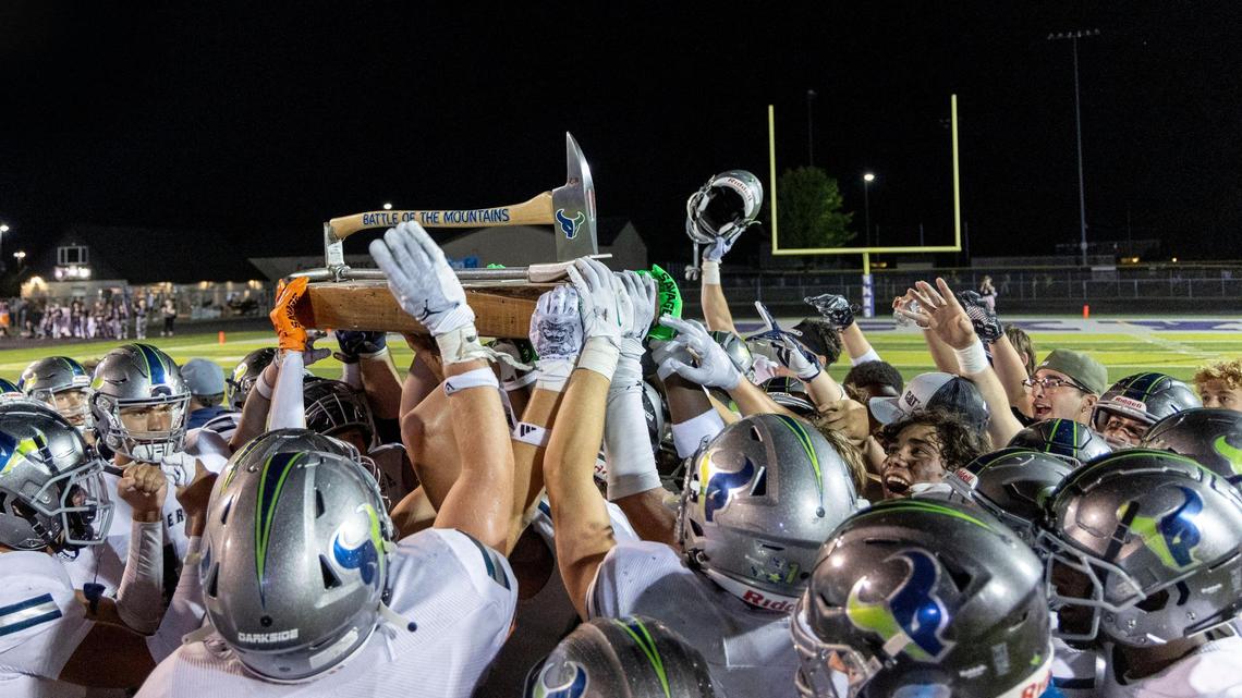Mountain View celebrates with the Battle of the Mountains rivalry trophy after defeating Rocky Mountain 24-14 on Friday.