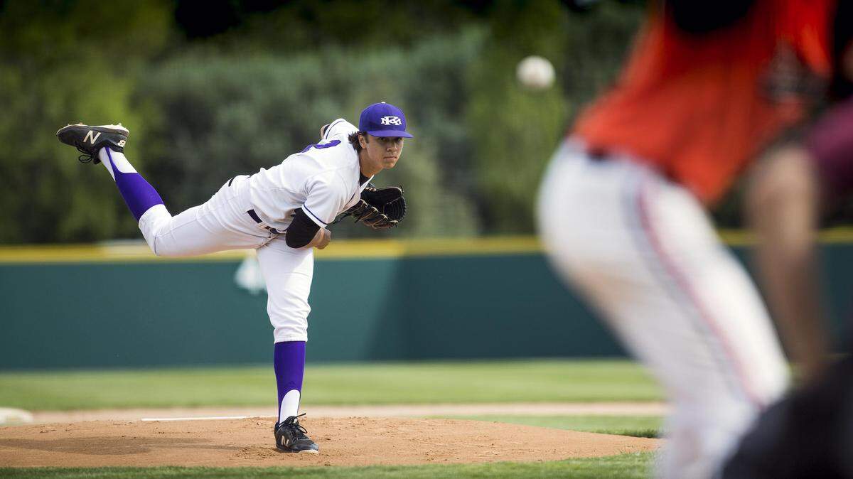 Rocky Mountain’s Gabriel Hughes pitches to a Post Falls batter in the state 5A baseball tournament May 17, 2018, at Borah High in Boise.