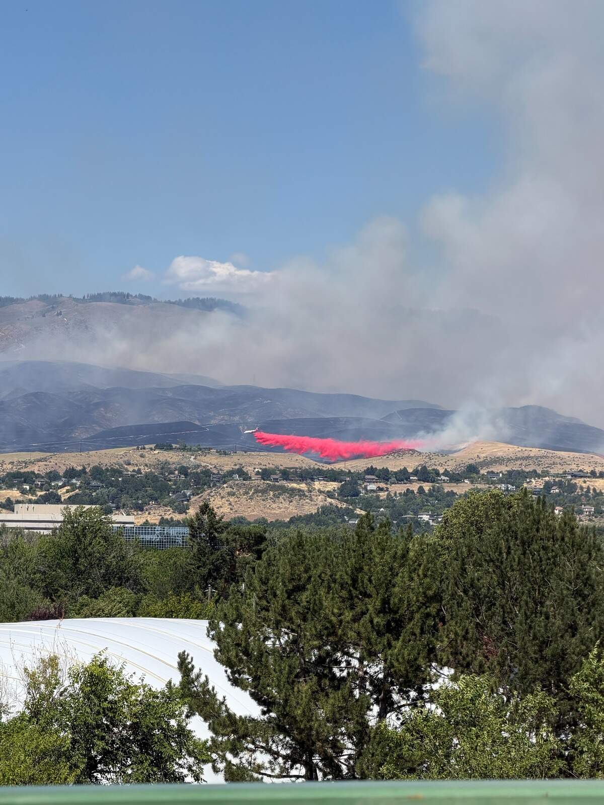 A tanker drops fire retardant at the edge of the Claremont Fire in the Boise Foothills on Monday.