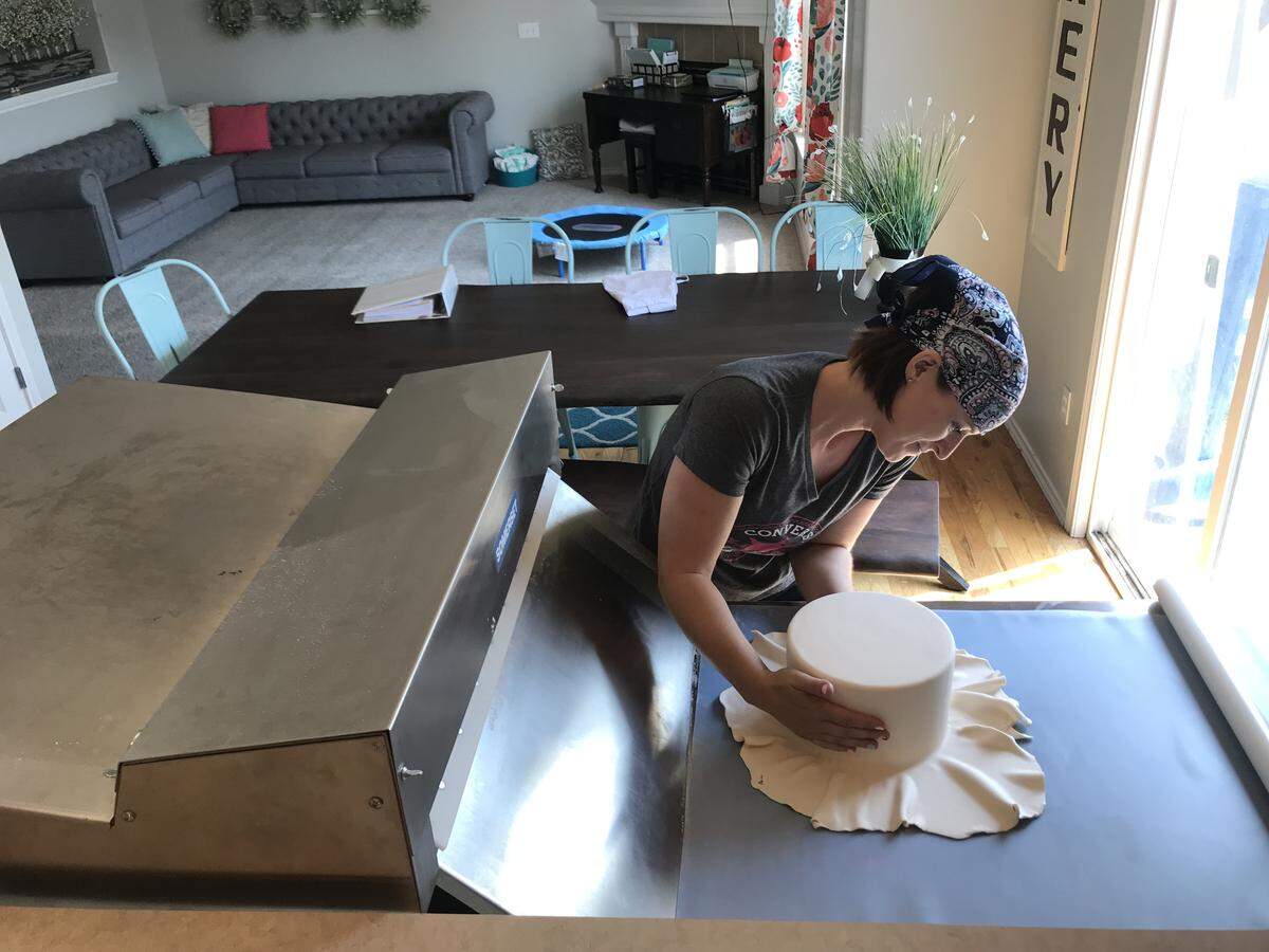 Keri Lainhart, who owns the at-home baking business Oh, For Heaven Cakes!, tries out her new Somerset fondant sheeter in her Meridian home. “Having the right supplies and using the right materials makes all the difference in the world,” she said. “I have people tell me all the time that they don’t like fondant, that they like the look of it but they don’t want to eat it. I say, ‘well, let’s try it because not all fondant is created equal.’”