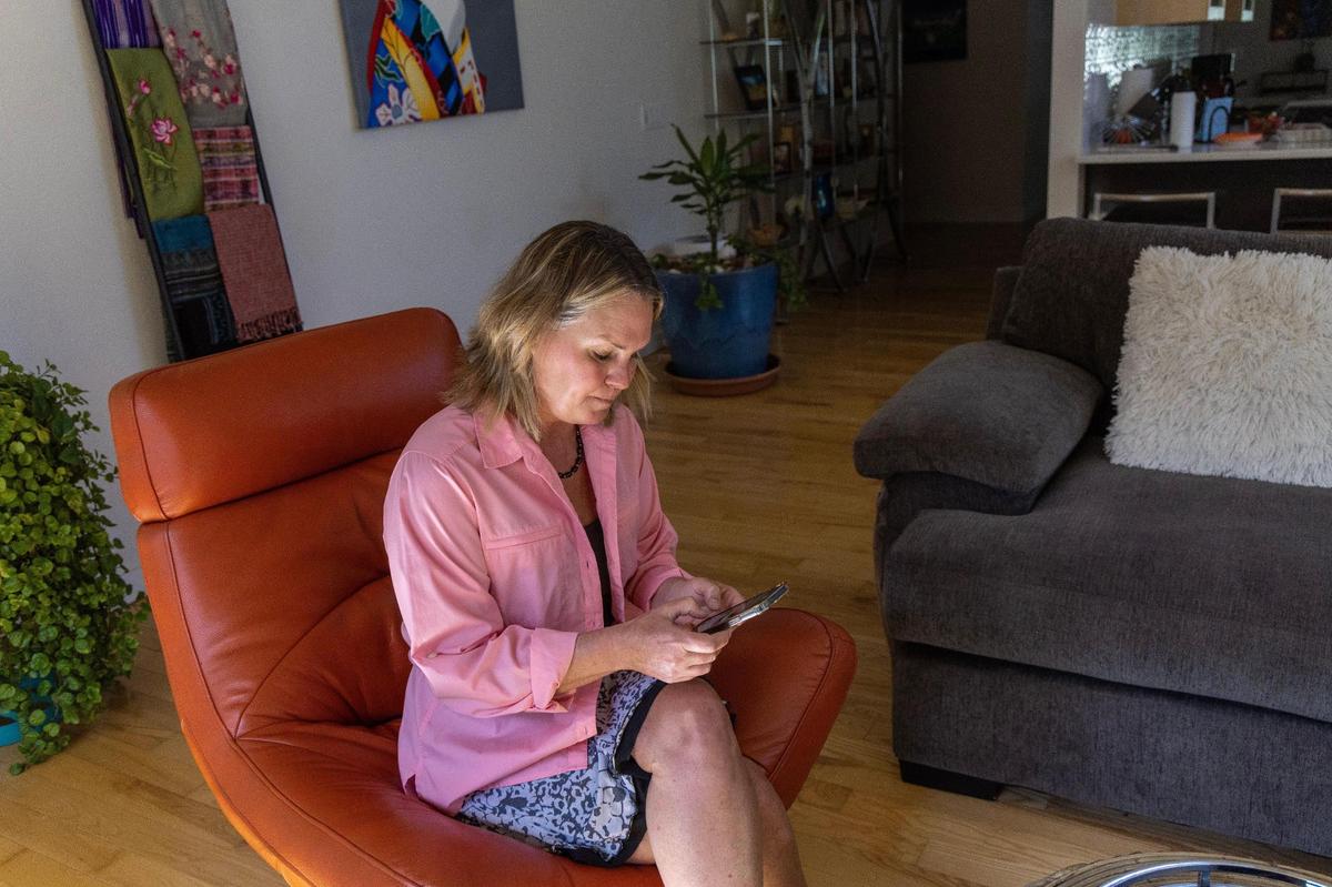 From her Boise home, Marianne Morrison sends a text message to her daughter who is incarcerated for possession of a controlled substance.