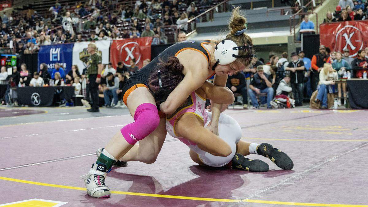 Try-Valley's Charlee Noah, left, and Redmond's Mia Pedersen, right, wrestle at the Rollie Lane Invitational, Saturday, Jan. 3, 2026. Noahl won 3-0 in a pin.