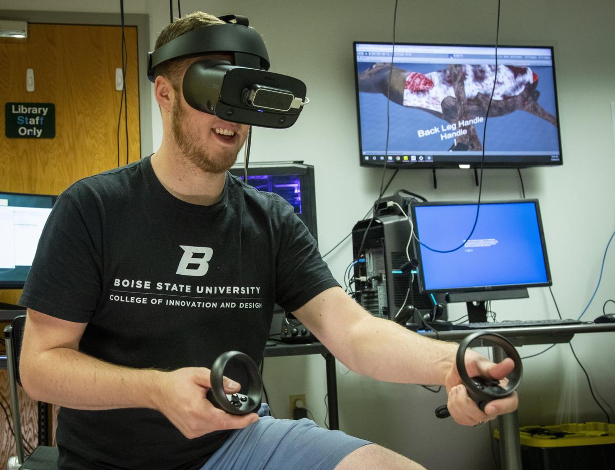 Dakota Kimble, a student in Boise State’s Gaming, Interactive Media and Mobile Department, gutlessly field dresses an elk in virtual reality. Kimble and Brannon Leman designed, programed and produced the education tutorial for Idaho Fish and Game.