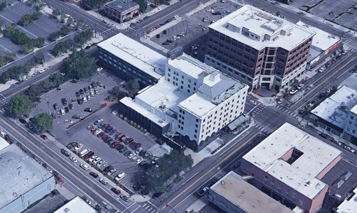 Hendricks Commercial Properties tentatively plans a seven-story boutique hotel with 100 to 130 rooms on Grove Street between 11th and 12th streets in the parking lot behind The Owyhee, the white building at the center that Hendricks owns. Eleventh Street is at lower right, Grove Street at lower left.