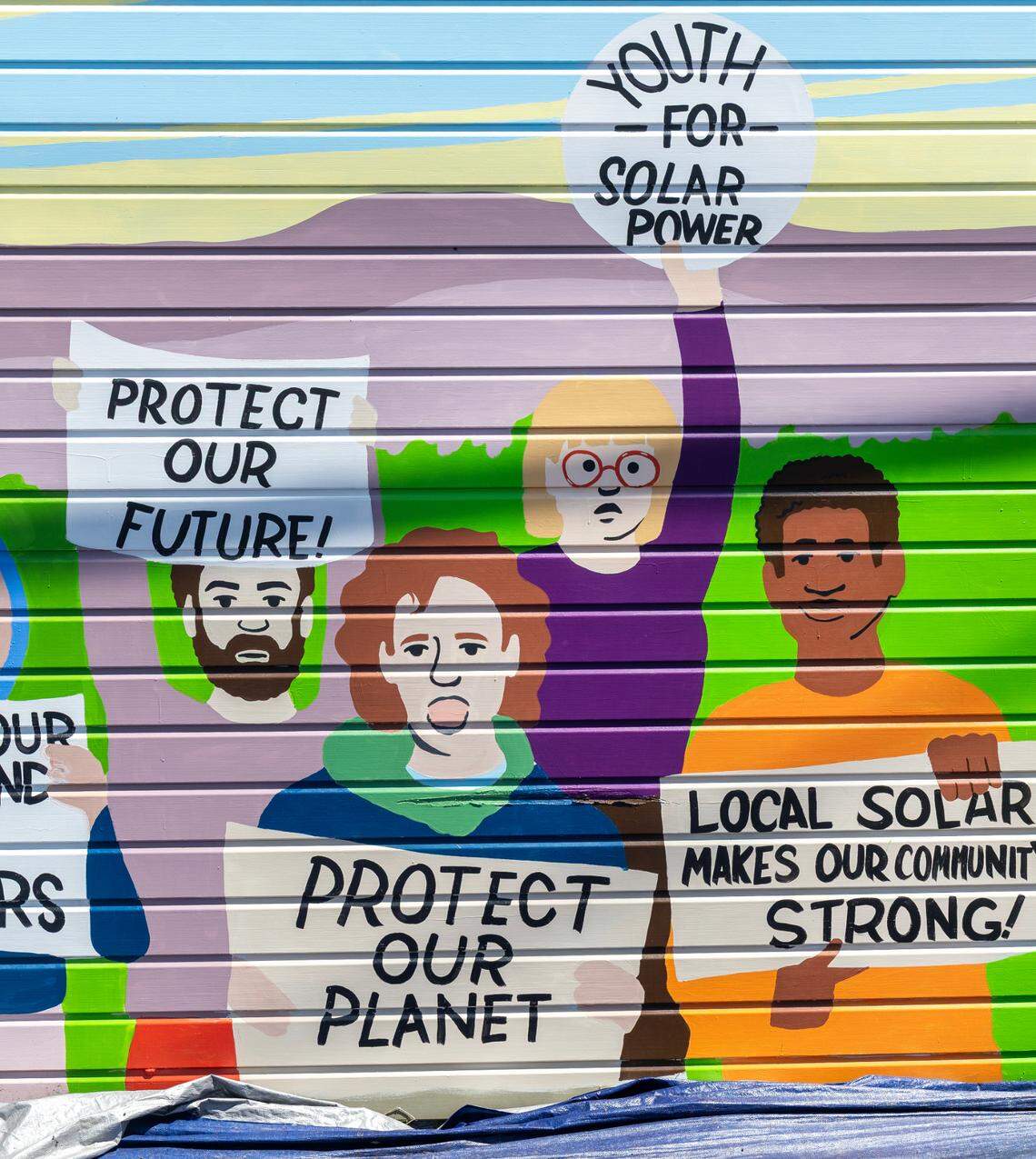 Students in the Climate Justice League came up with ideas that muralists then incorporated into the design. The students and adult volunteers did the painting. “The final result of the mural we designed is really an effort in collaboration,” said Anise Welty, 16, the league’s youth leader.