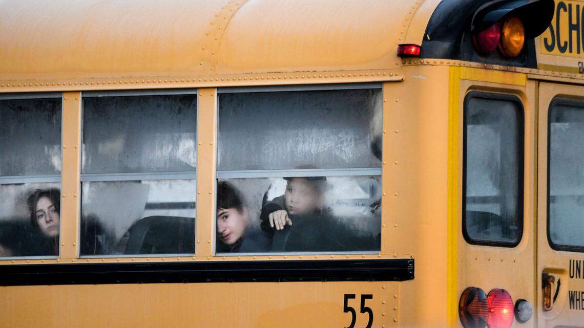 Children ride a bus to school in this 2020 file photo.