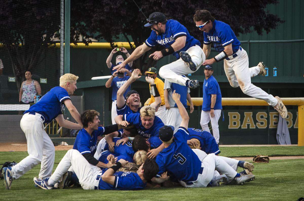 Timberline’s baseball team piles onto the infield after beating Bonneville for the 5A state baseball championship last spring.