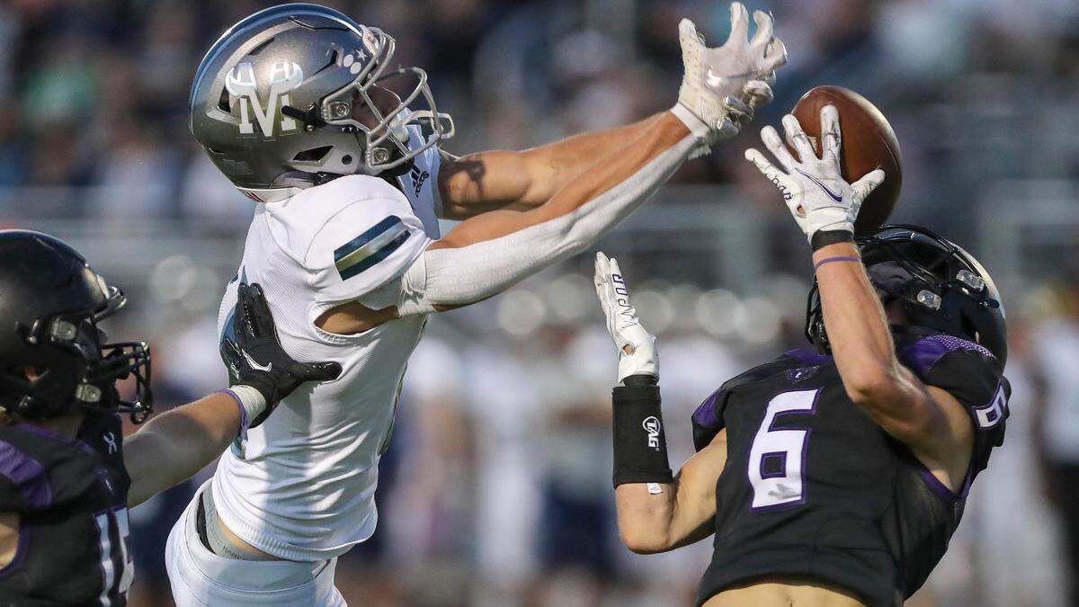 Rocky Mountain defensive back Troy Wilkey, right, breaks up a pass last season against Mountain View.