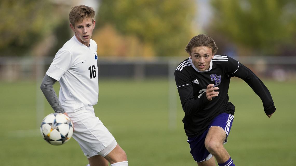 Rocky Mountain senior Ryken Dizes sprints to advance the ball past Timberline’s CJ Brewster in last year’s 5A District Three soccer championship game.