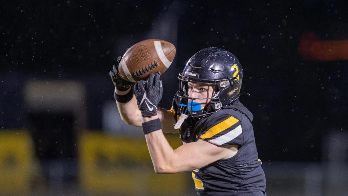 Bishop Kelly wide receiver Boston Huskey hauls in a third-quarter catch Friday against Pocatello.