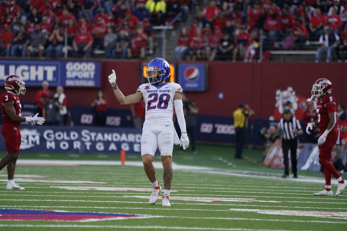 Boise State defensive back Kekaula Kaniho celebrates after a stop against Fresno State on Saturday. Kekaula and his brother, Kaonohi, both had interceptions in the victory.