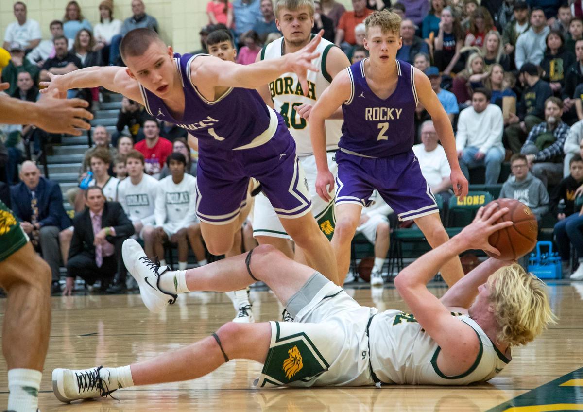 Borah forward Austin Bolt looks to pass around Rocky Mountain’s Jaden Hansen after a loose-ball scramble earlier this season.