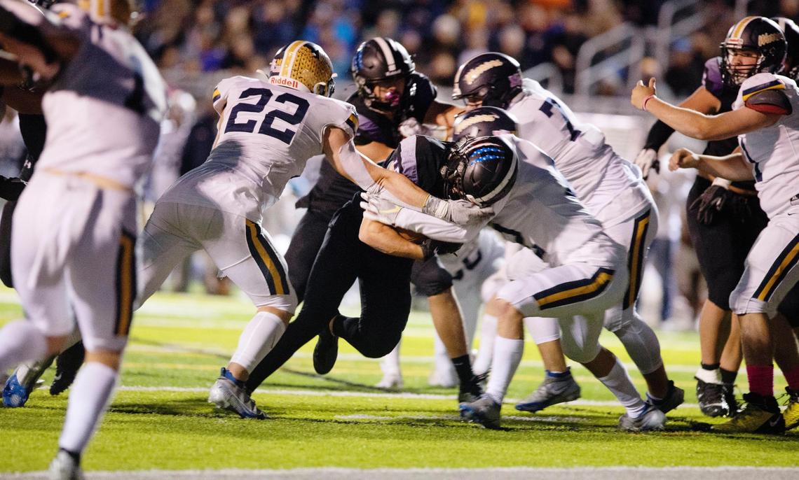 Rocky Mountain running back Art Williams breaks through Meridian defenders on a 5-yard touchdown run in the first half Friday.