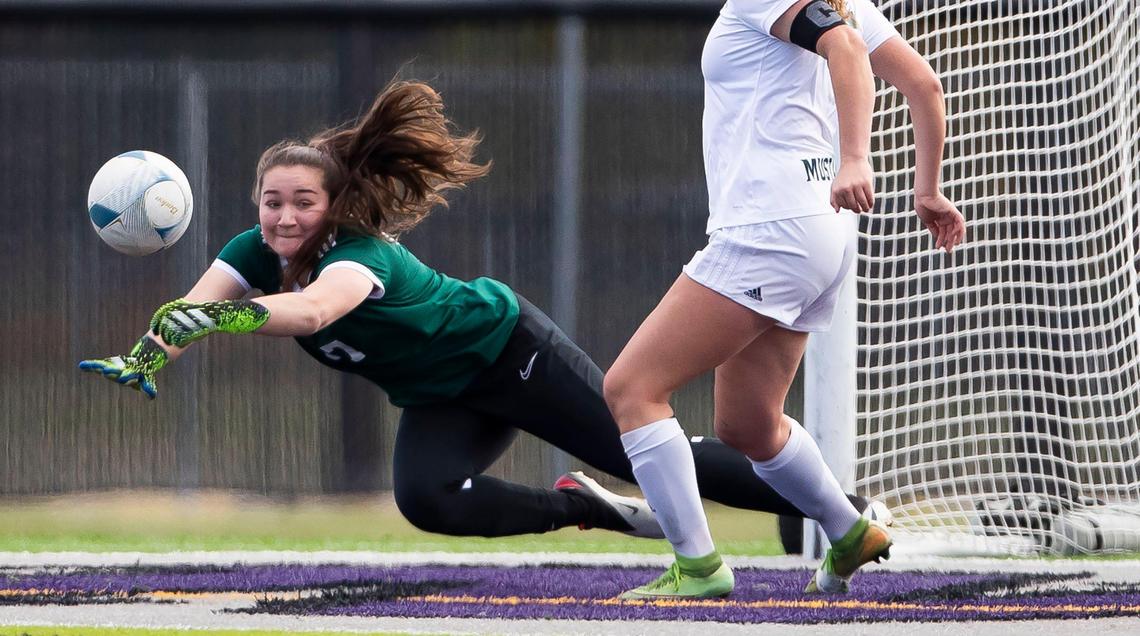 Eagle goalkeeper Casey Southard leaps to stop a shot at the 2021 state tournament.