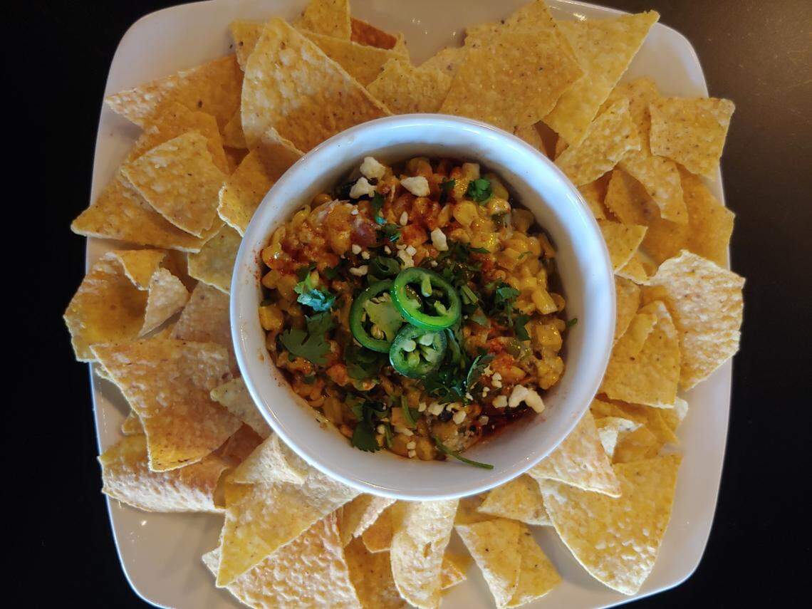 Mexican Street Corn ($5.95): pan-blackened corn with garlic, mayo, spices, butter and Cotija with fresh cilantro.