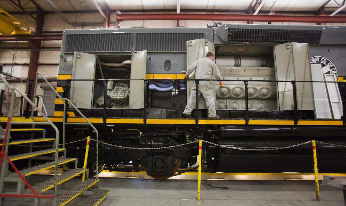 Electrician Jon Damon works on a freight locomotive, which is nearly finished, in 2012 for Belt Rail Co. in Chicago.