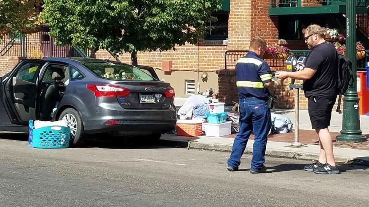 Boise bar owner Ted Challenger, right, paid for a woman’s parking tickets when he saw her car was about to be towed.
