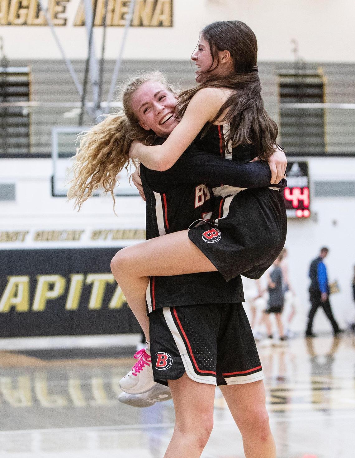 Boise sophomore Avery Howell, left, and Sophia Clark, right, embrace after the Brave beat Timberline 44-36 in overtime for the 5A District Three Tournament title.