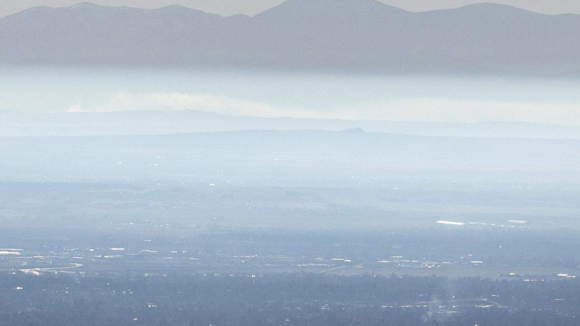 A cold-air inversion is visible looking south to the Owyhee Mountains on Nov. 27, 2021. The thick layer of clouds that hangs low over the Treasure Valley will trap in any pollutants, particularly carbon dioxide from cars.