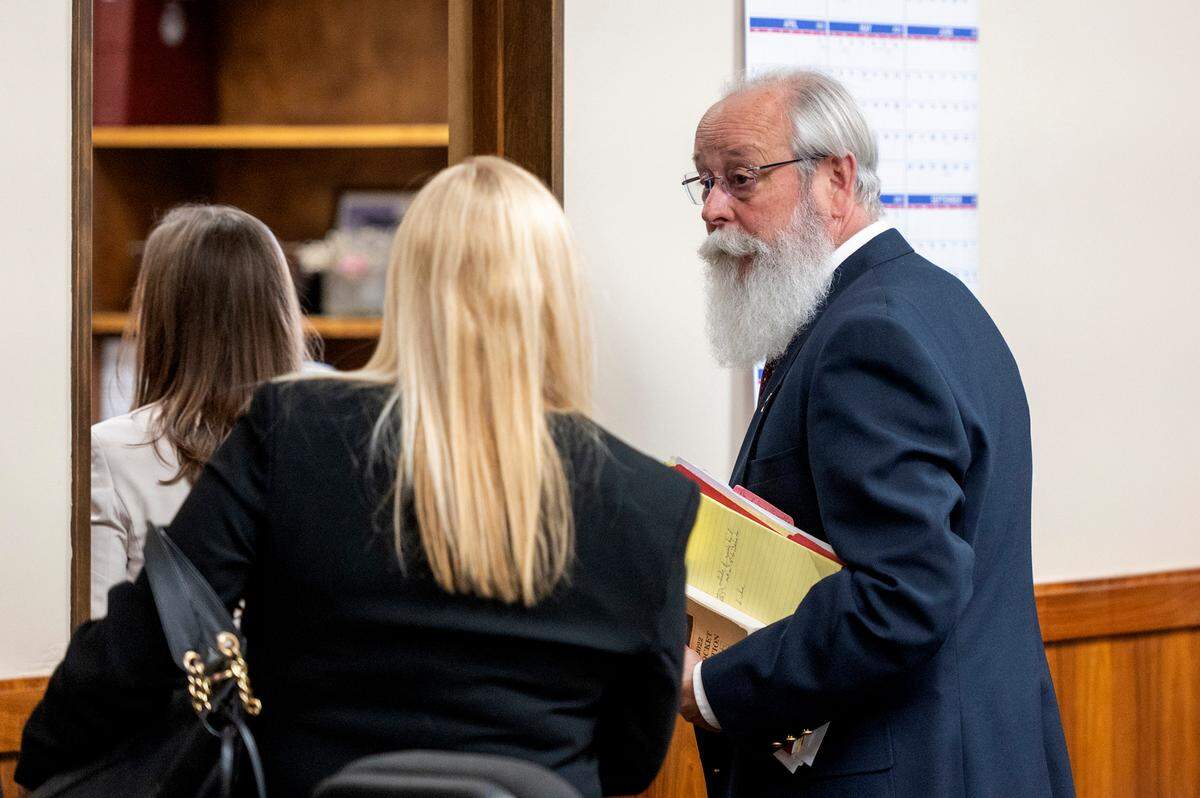 Latah County Prosecutor Bill Thompson, right, speaks with Anne Taylor during a hearing for her client Bryan Kohberger, who is charged with killing four University of Idaho students in November 2022.