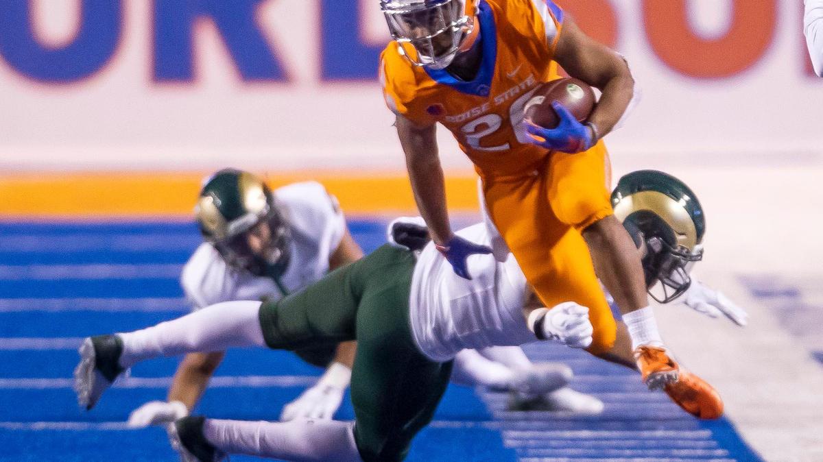 Boise State senior Avery Williams (26) evades Colorado State tackles on a punt return Nov. 12 at Albertsons Stadium.