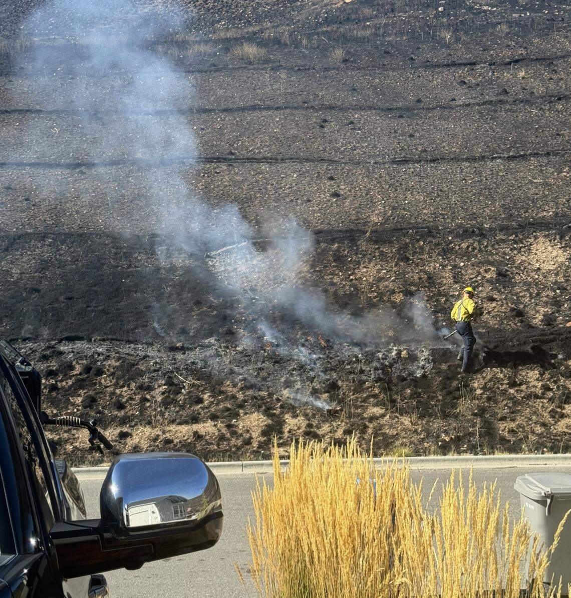 This photo submitted to the Statesman by homeowner Adam Guyton shows how the Valley Fire burned right up to the edge of his road, just across from his house in Harris North.