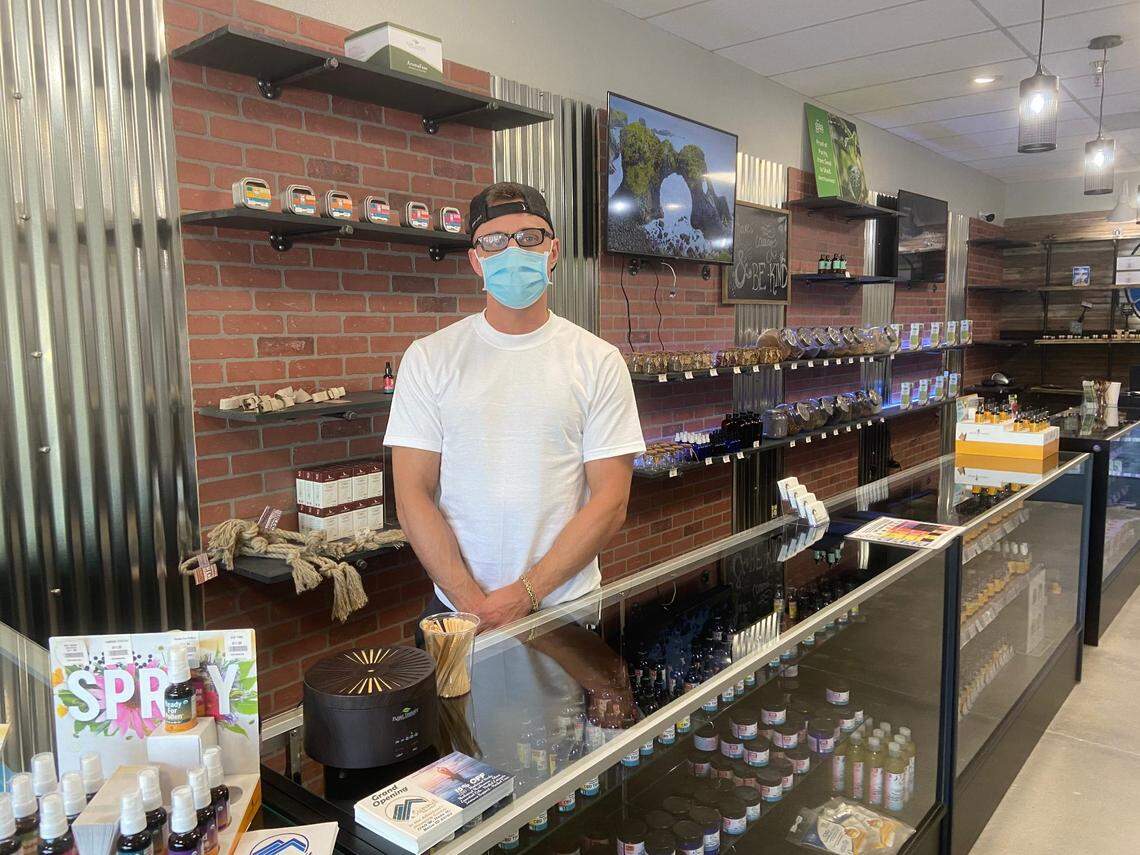 Kevin Pabst, co-owner of Summit Wellness in downtown Boise, stands at the front of his store. When people don’t wear masks, Pabst said, he worries he about the health of older and at-risk populations.