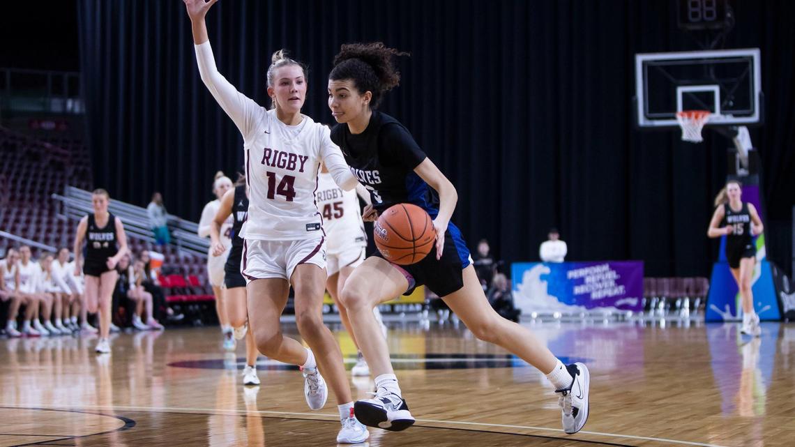 Timberline’s Emmie Swillie drives to the hoop defended by Rigby’s Kambree Barber during last season’s state tournament.