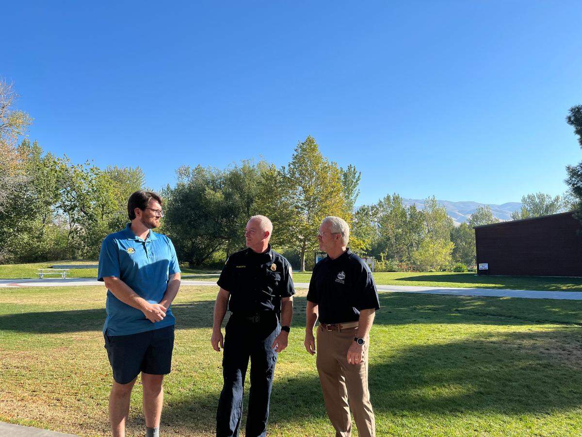 From left, Ada County Parks & Waterways Program and Education Specialist Robert Sosin, Boise Fire Department Special Operations Division Chief Paul Roberts and Boise Parks and Recreation Director Doug Holloway discuss the 2022 floating season at Barber Park on Wednesday morning.