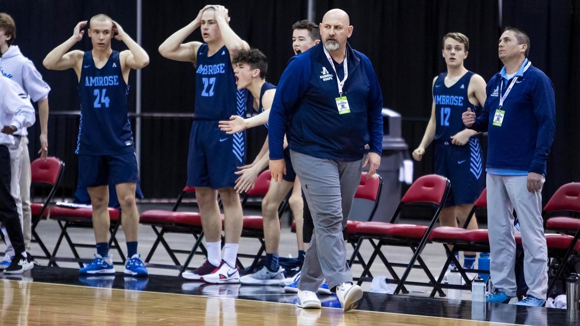 Ambrose coach Ken Sugarman and his boys basketball team react to their one-point loss to St. Maries in the 2A boys basketball state championship Saturday at the Ford Idaho Center in Nampa. The Archers were leading in the final minutes of the game, but lost to the Lumberjacks 51-50.