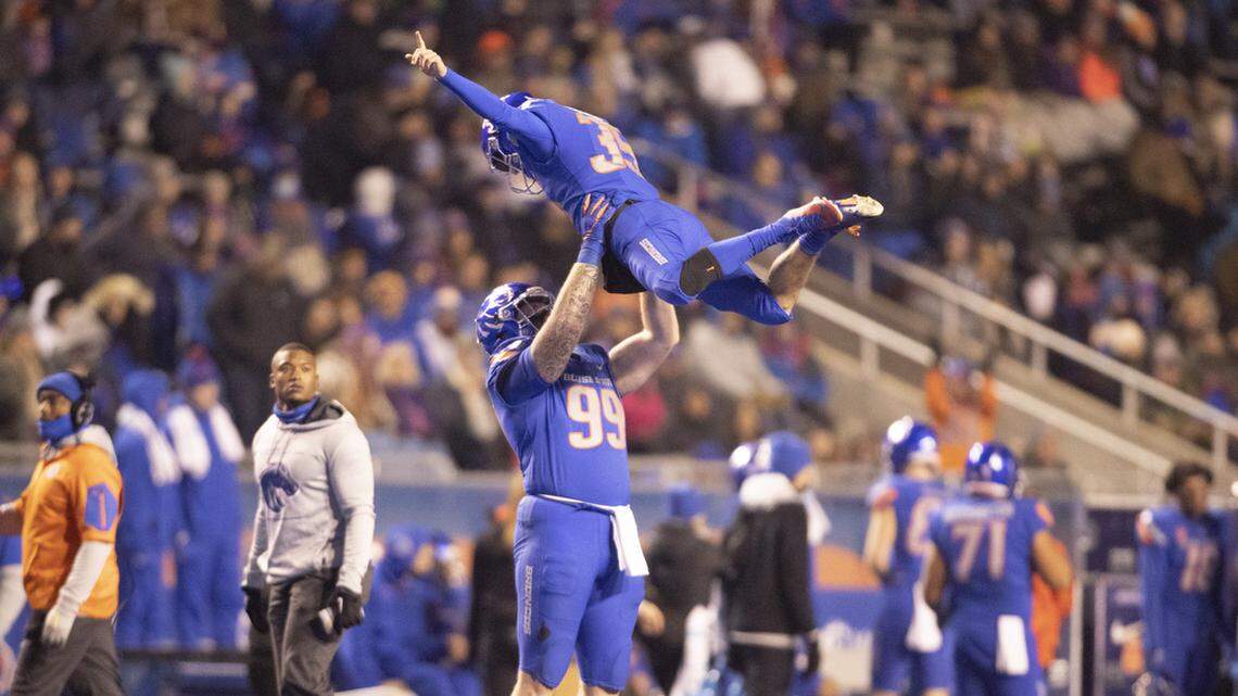 Boise State kicker Jonah Dalmas gets thrown into the air by teammate Boise State defensive tackle Scott Matlock after his third field goal of the game during the second half of the game at Albertsons Stadium. Boise State defeated New Mexico 37-0 at the half Saturday November, 20, 2021.