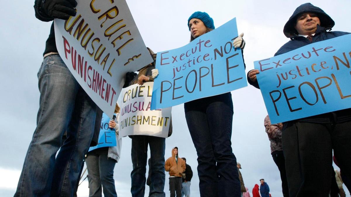 A group protests before the execution of Idaho death row inmate Paul Rhoades on Nov. 18, 2011. The potential lethal injection of convicted murderer Gerald Pizzuto has renewed scrutiny of Idaho’s controversial tactics in employing lethal injection.
