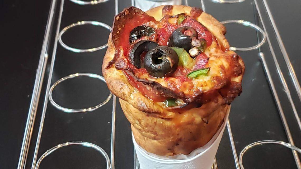 The innovative pizza cones at Coned hold together well and have good flavor, with the rich tomato sauce a highlight.