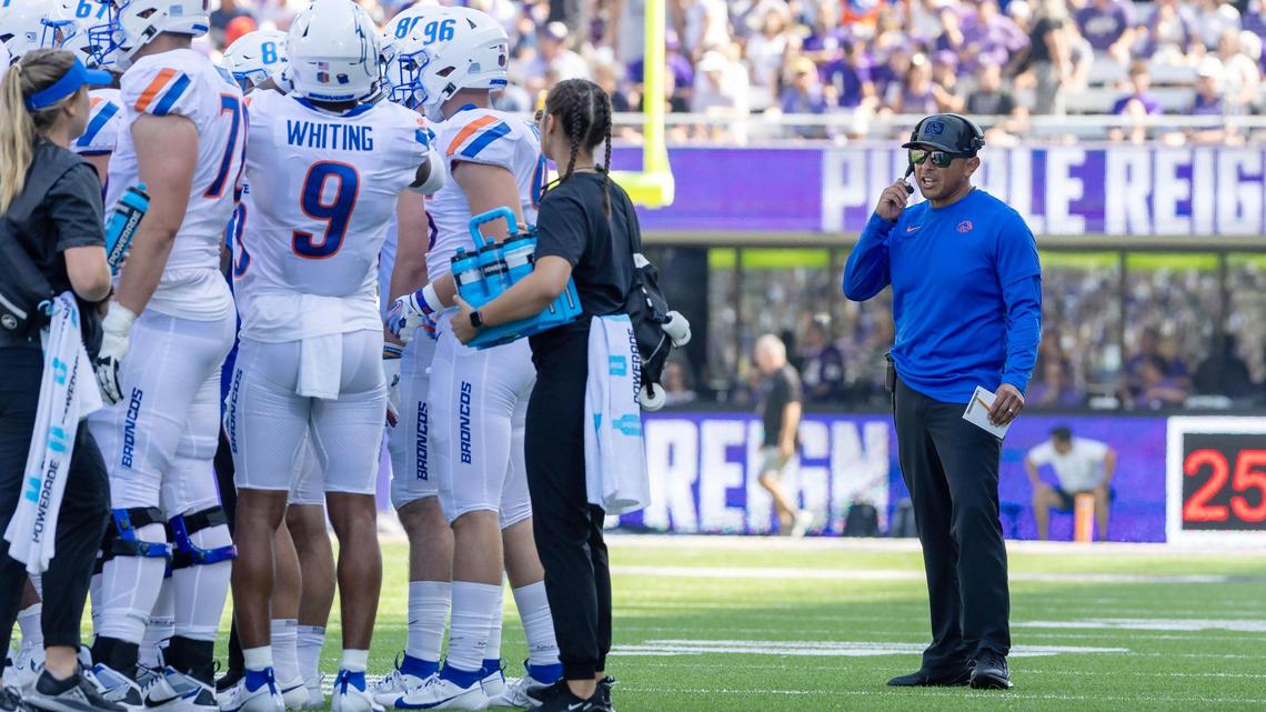 Boise State head coach Andy Avalos talks on his headset during a media timeout in the first half of their game against the University of Washington on Saturday at Husky Stadium in Seattle.