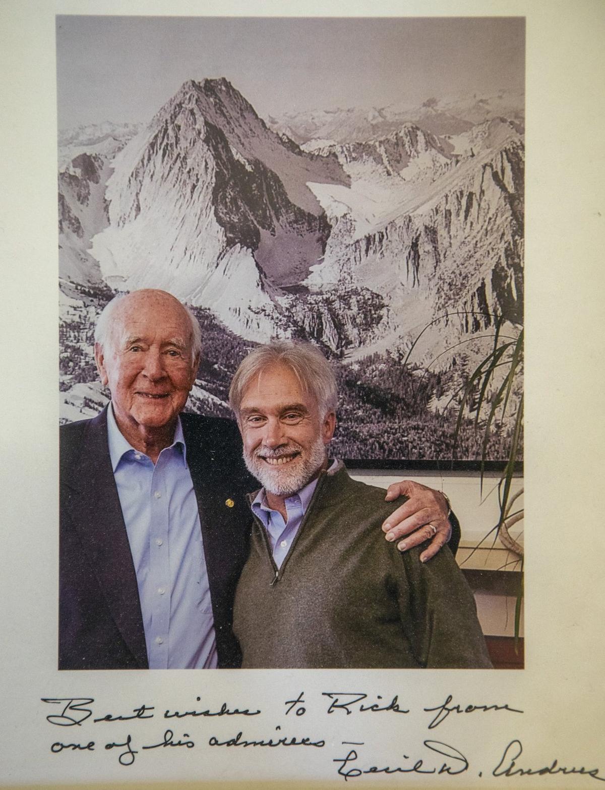 Photographer Ernie Day took the quinessential photograph of Castle Peak to show where a molybdenum mine was proposed at the mountain’s lap. The issue, which Democrat Cecil Andrus opposed, got him elected governor of Idaho in 1970. Rick Johnson, right, interviewed Andrus for a chapter in a book about Idaho wilderness, and shortly before Andrus died, they posed together in front of Day’s photo in the Idaho Conservation League office. The autographed image with Andrus is one of Johnson’s cherished possessions. 
