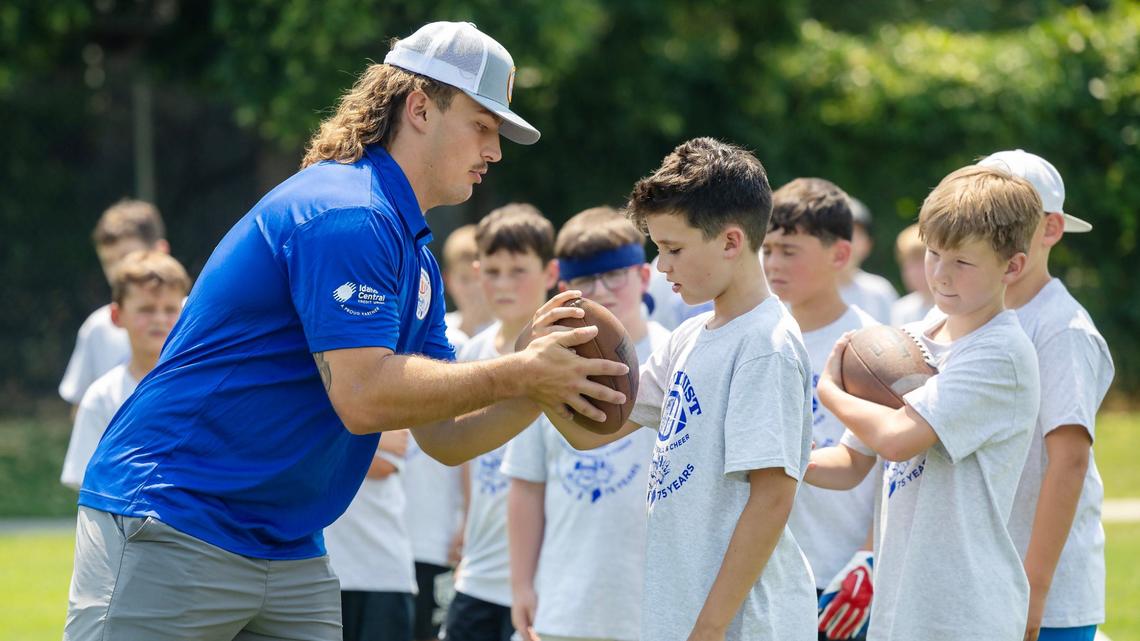 Boise State running back Tyler Crowe teaches a drill at the Optimist Youth Football Kids Skills Camp.