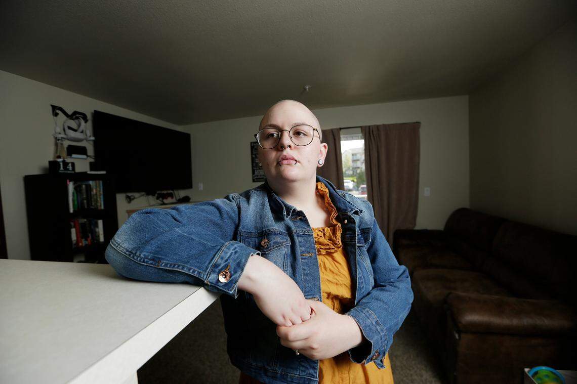 Mara Deloney, a former resident at Cornerstone Cottage in Post Falls, poses for a photograph at her apartment in Pullman, Washington.