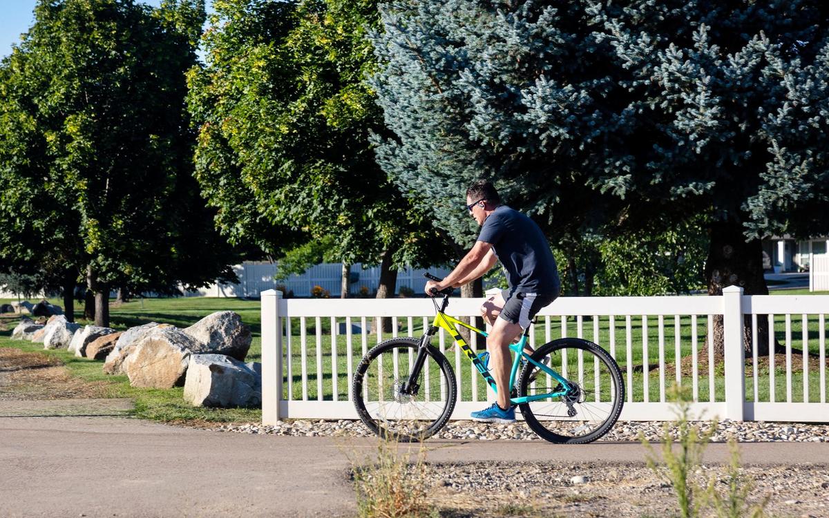 A cyclist uses Five Mile Pathway near Ustick Road. Five Mile is one of the major pathways in the city of Meridian.