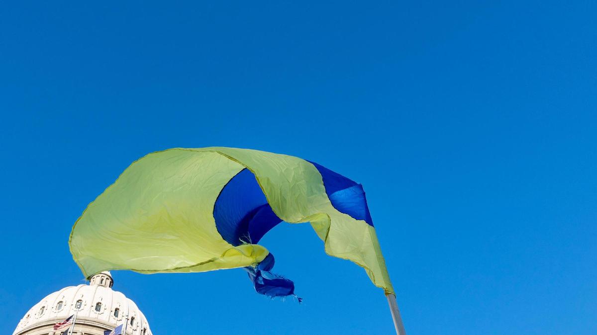 Yaroslav Yaroshchuk holds a Ukrainian flag while standing outside of the Idaho Capitol Building on Saturday, Feb. 26, 2022, to rally against the Russian invasion of Ukraine.