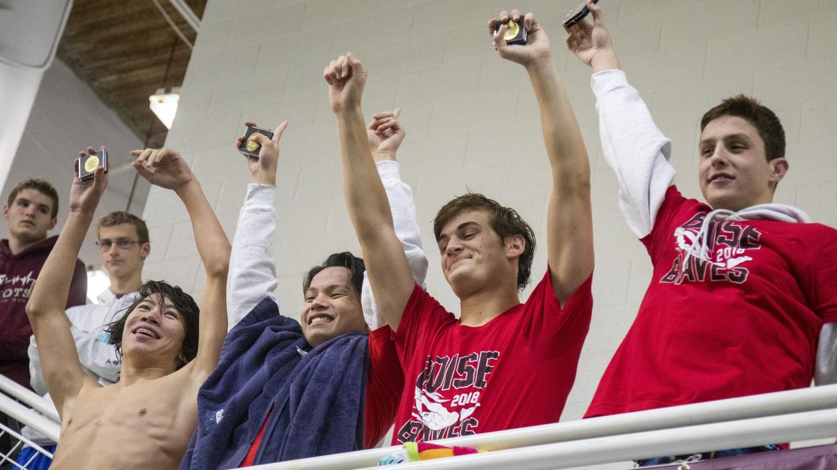 The Boise boys 200-yard medley relay team celebrates a 5A state title at the West Boise YMCA on Saturday. From left: Milo Shu, Tim Wong, Zach Stevens and Nathan Quarterman.