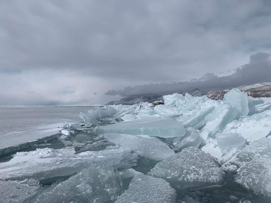 The ice mounds form as winds cause waves in exposed water, pushing the ice up against the shoreline.