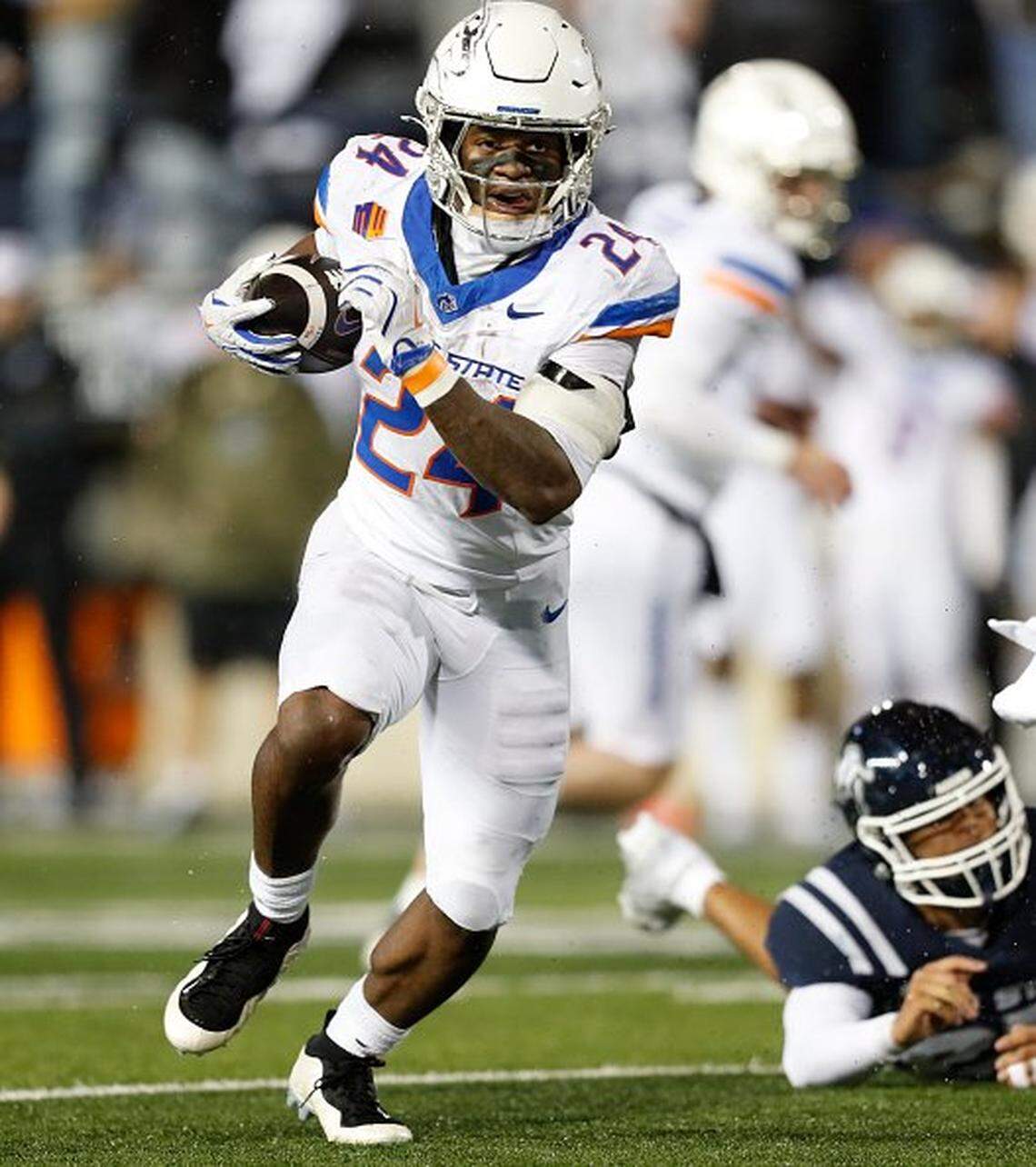 LOGAN UT - NOVEMBER 28: Dylan Riley #24 of the Boise State Broncos rushes for the game winning touchdown agaisnt during the second half of their game against the Utah State Aggies at Maverik Stadium on November 28, 2025 in Logan, Utah. (Photo by Chris Gardner/Getty Images)